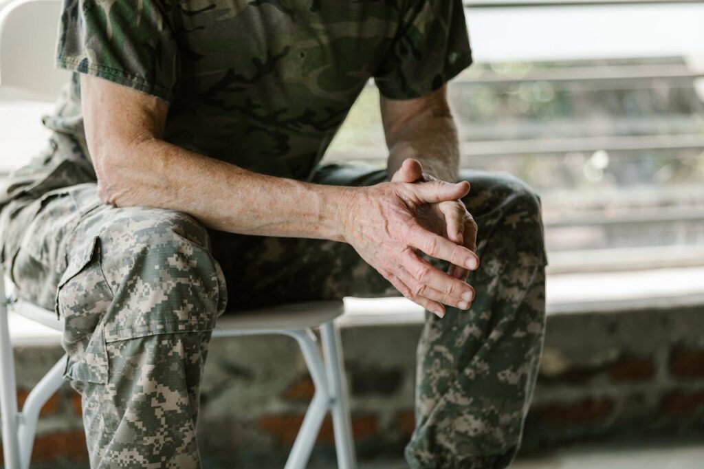 man in military uniform sitting
