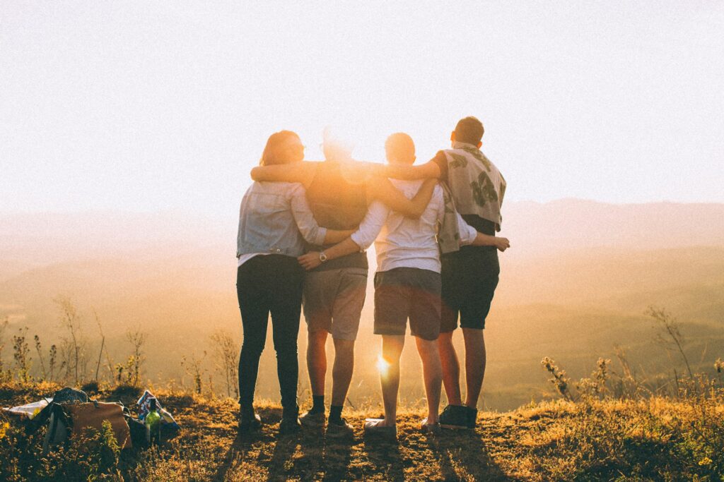 helena-lopes-PGnqT0rXWLs-unsplash four people hand wrapped