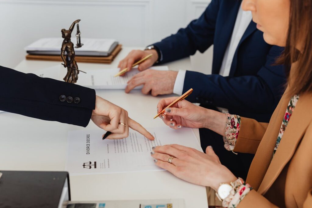 couple signing a divorce decree