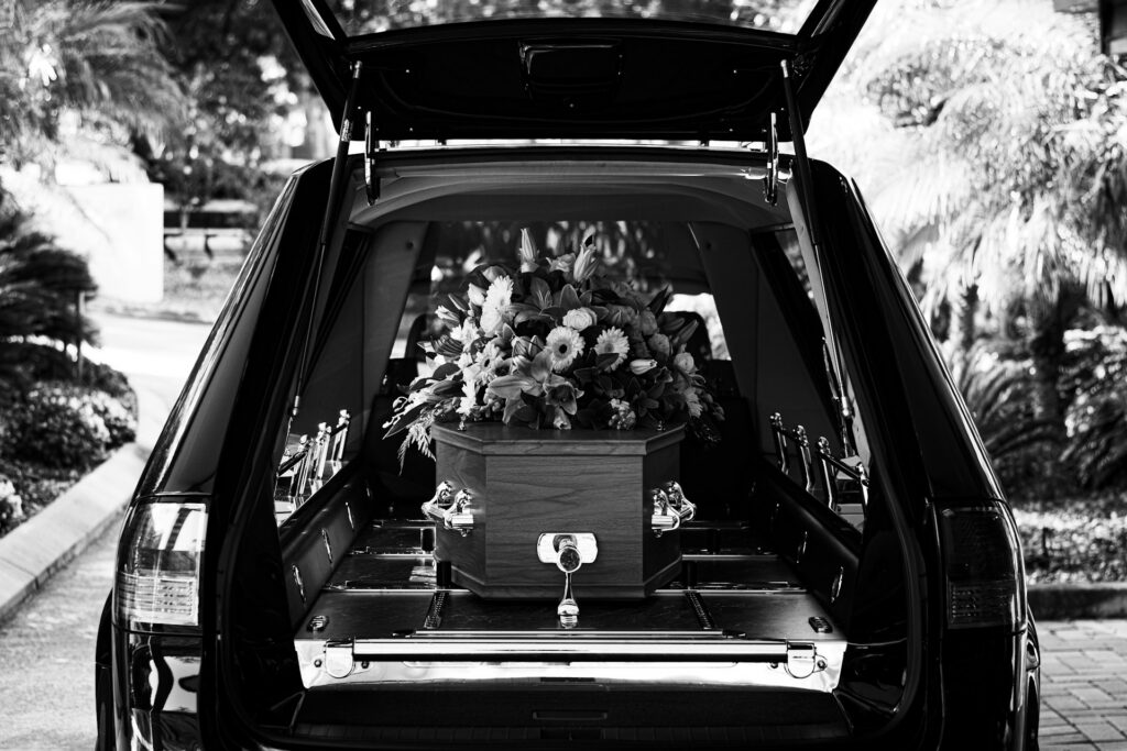 panyawat-auitpol-eq254Cqvmk8-unsplash funeral car with casket inside