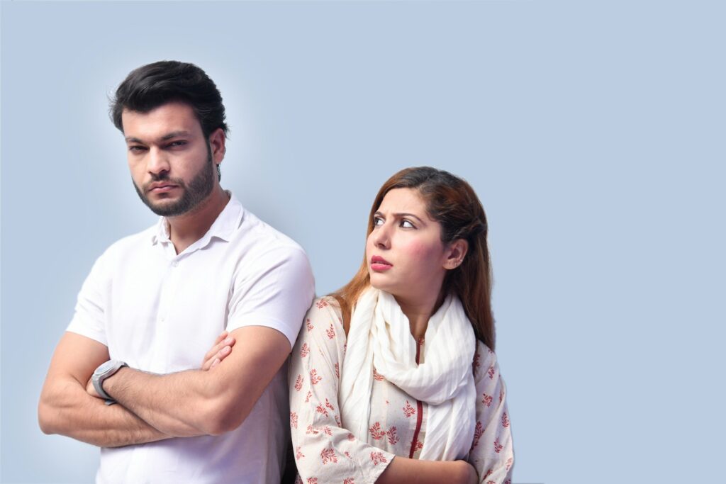 man and woman both looking displeased