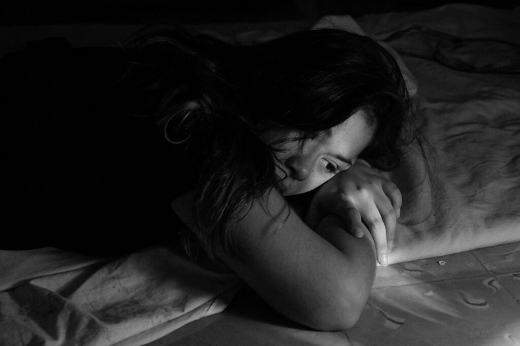 woman leaning in bed