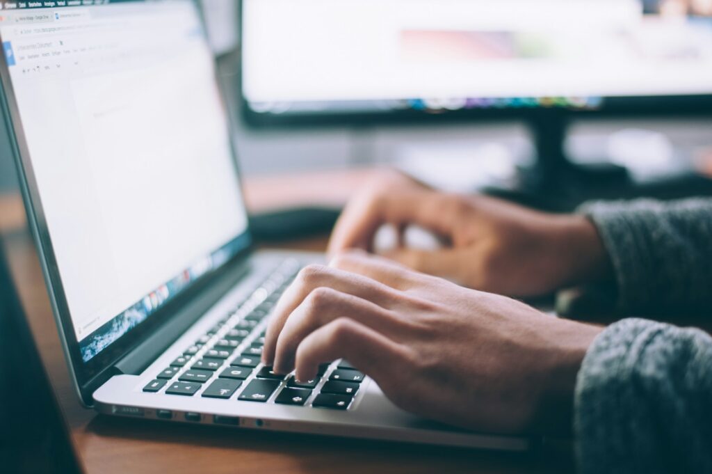 glenn-carstens-peters-npxXWgQ33ZQ-unsplash a person using laptop