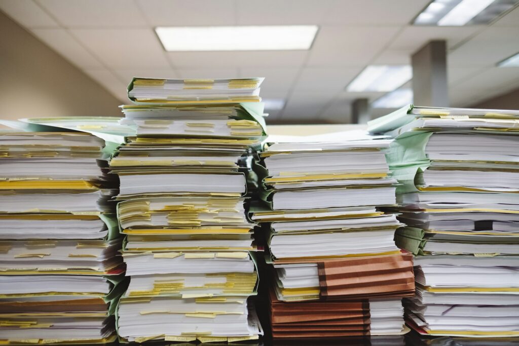 wesley-tingey-snNHKZ-mGfE-unsplash stack of documents