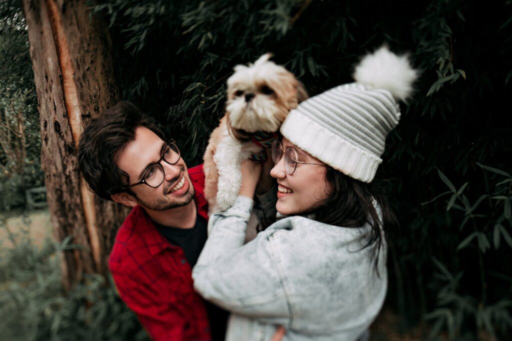 couple holding a dog