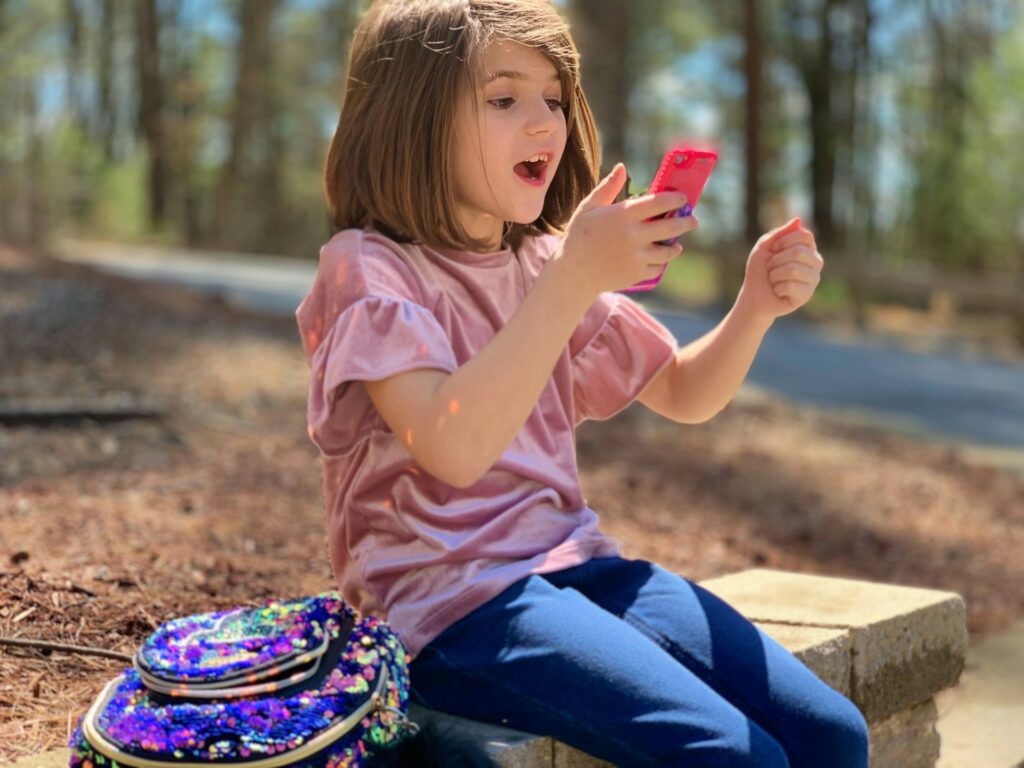 christopher-ryan-s9EuclXMc3M-unsplash a girl sitting on a bench at a park