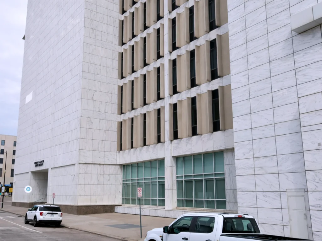George L. Allen Courts Building exterior from front side angle showing facade and window rows