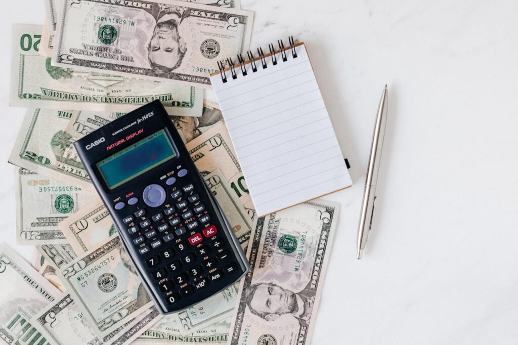 pexels-karola-g-4386373 Cash with calculator and notepad