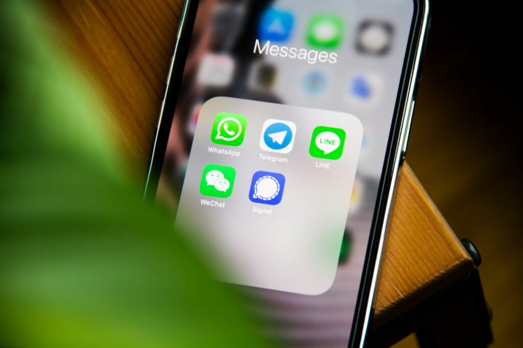 adem-ay-zs-41Br0WhQ-unsplash phone with messages on screen