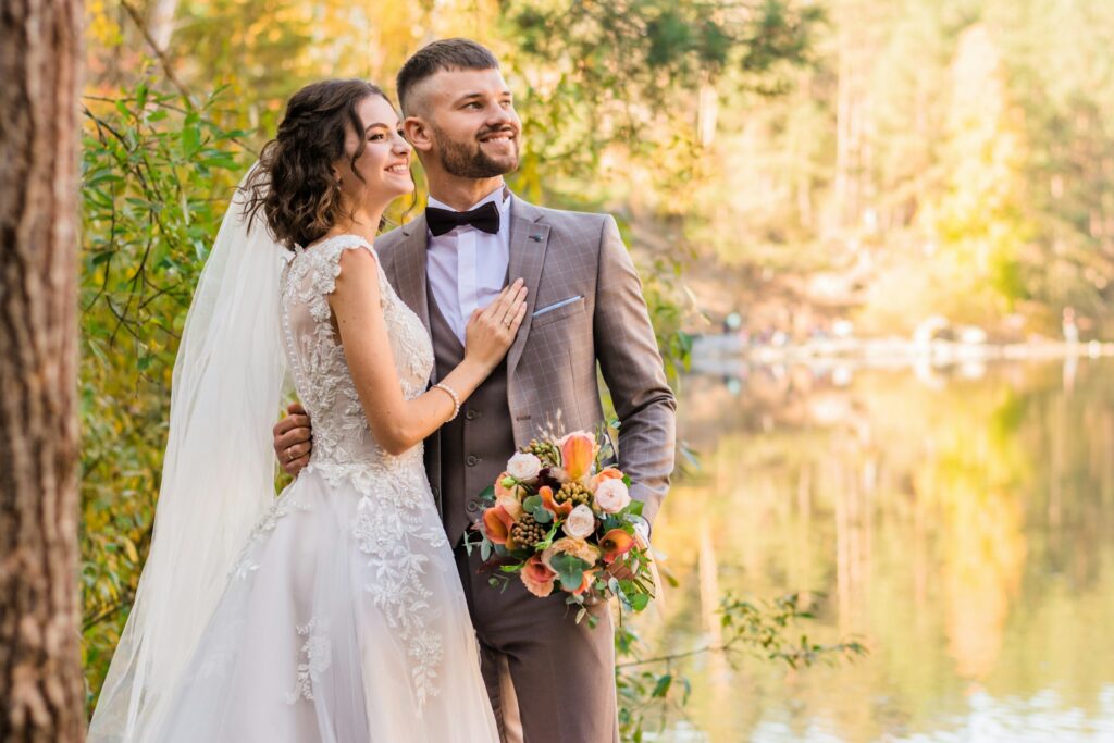 man in a gray suit and a woman in wedding gown