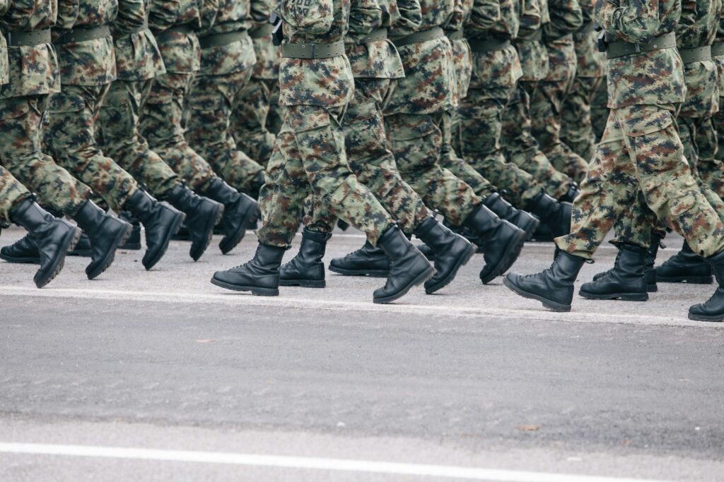 men in military uniform marching
