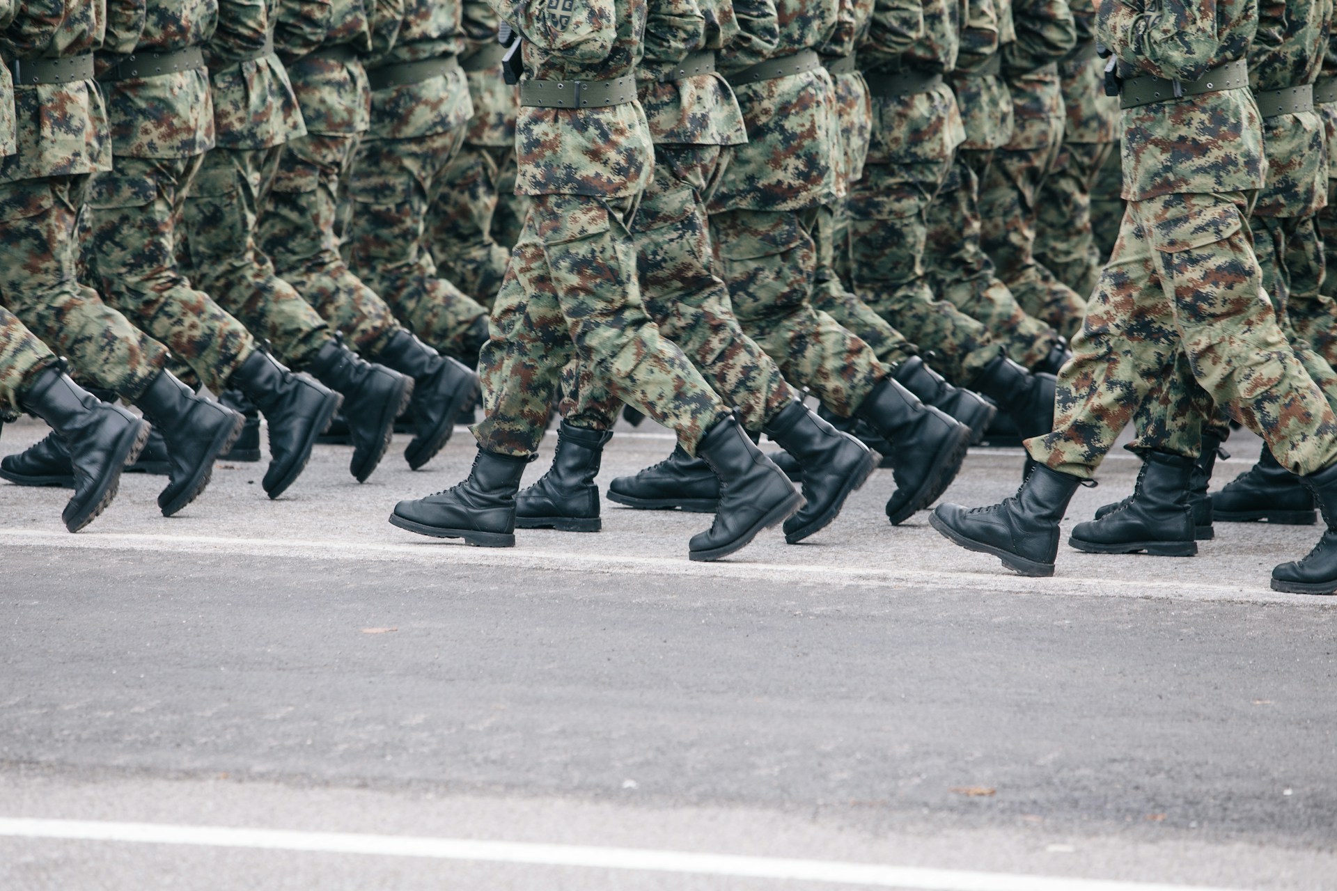 men in military uniform marching
