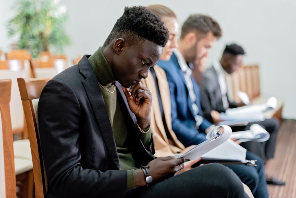 people seated while reading a document