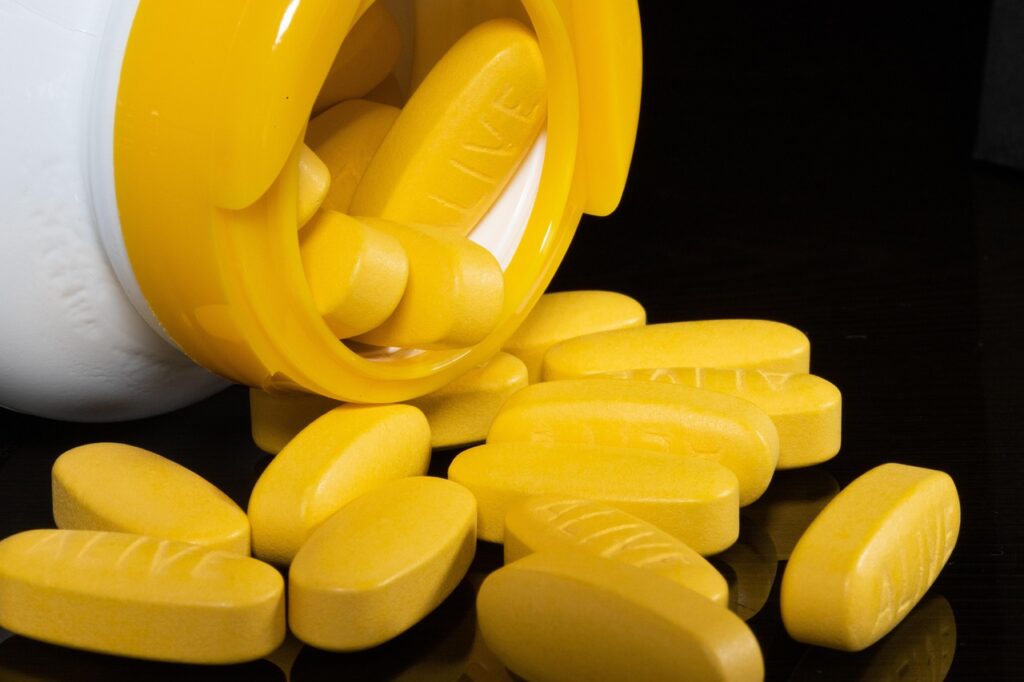 yellow pills from a bottle