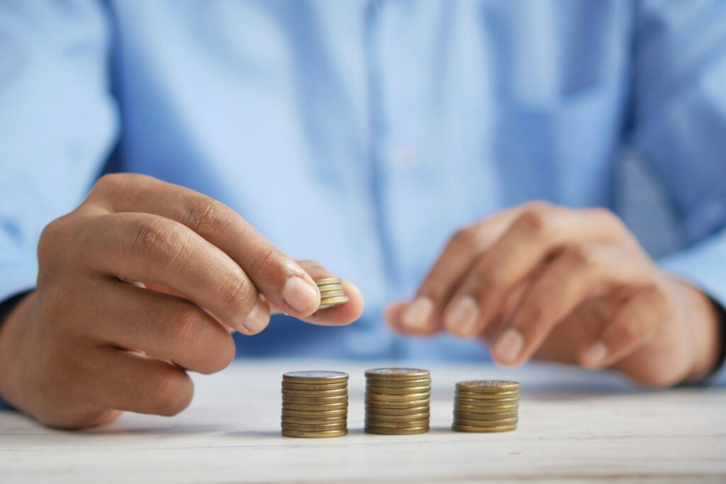 A man arranging coins