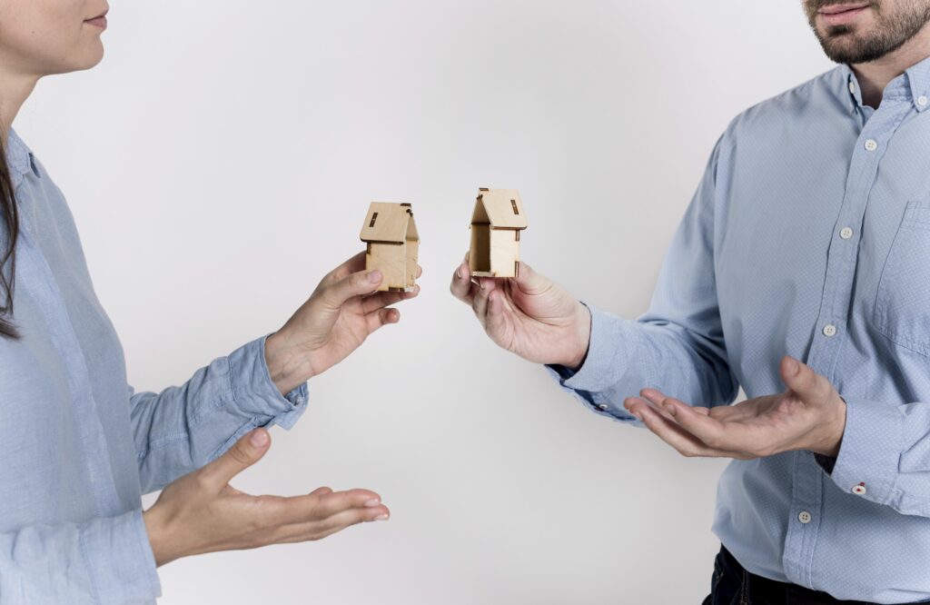 The couple discussing property because they are divorced with the help of property division lawyers.