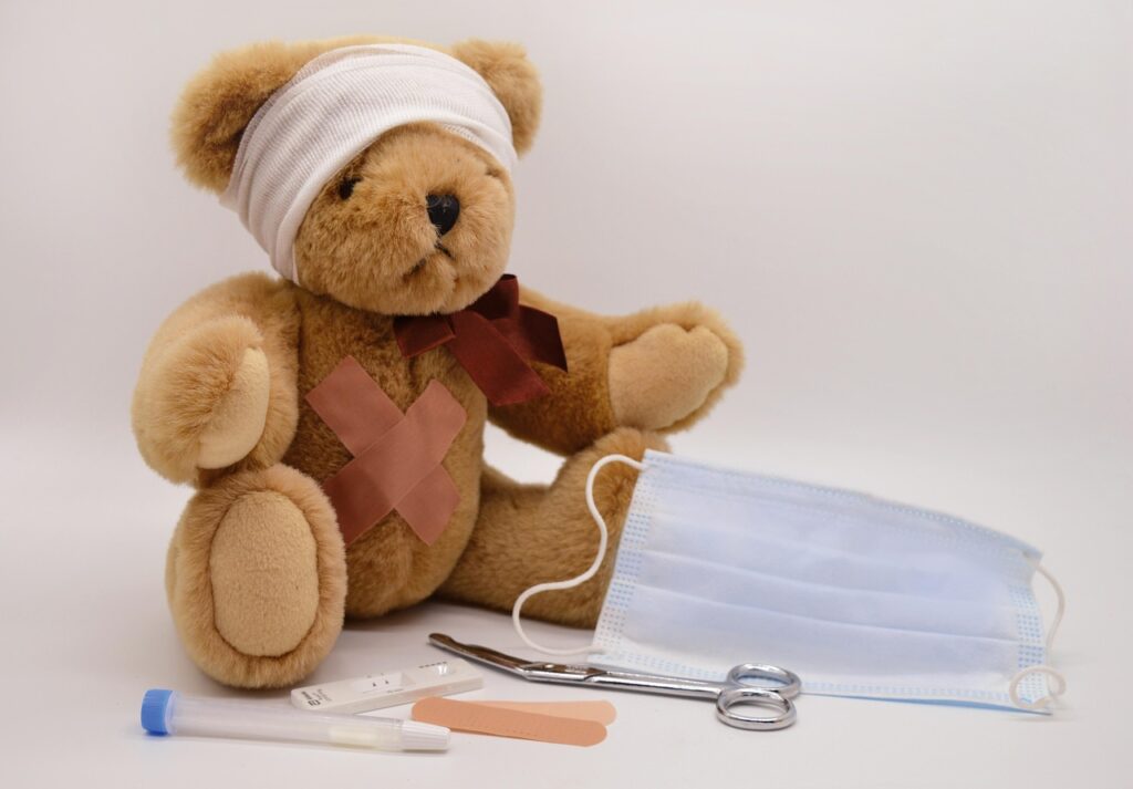 Teddy bear with bandage and surgical tools