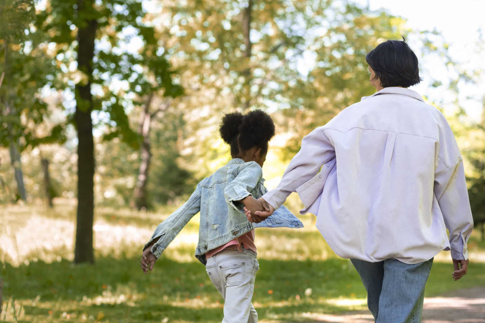 The father and daughter are enjoying themselves outdoors. The father has the right to parent his daughter.