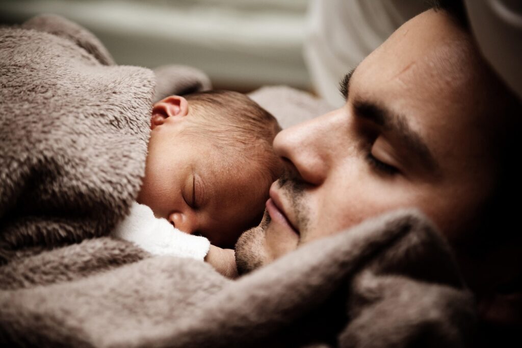 A father and newborn baby