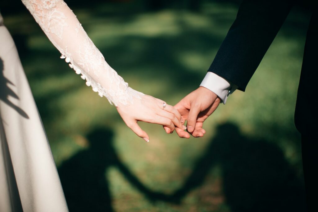 Newlywed holding hands