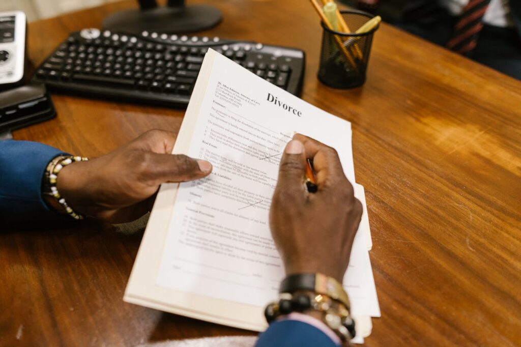 person signing divorce paper