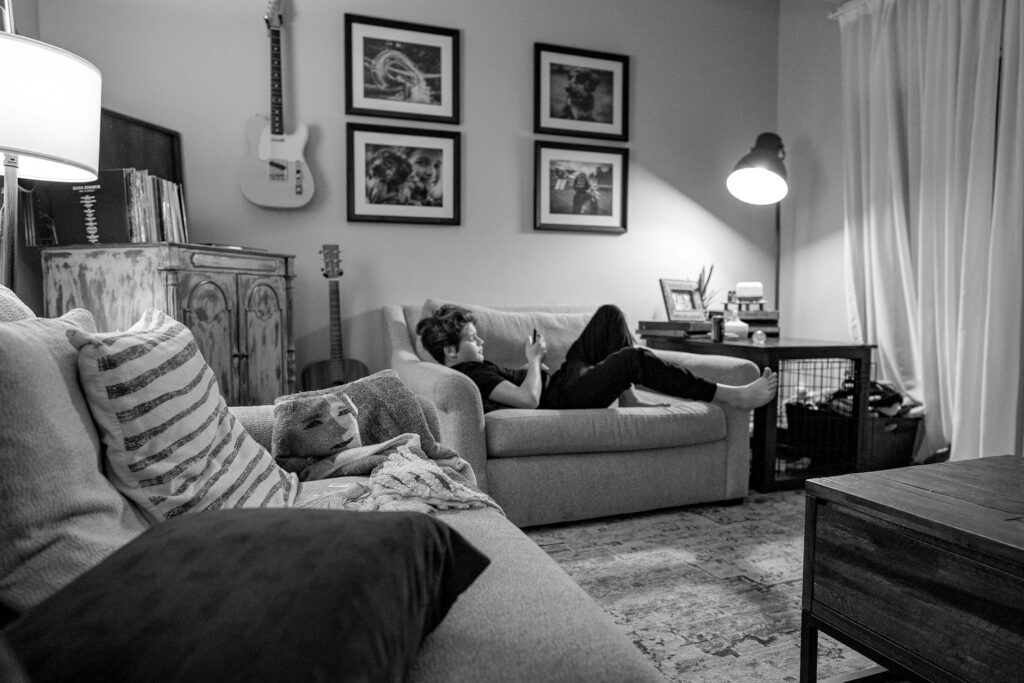 a teen relaxing on the couch