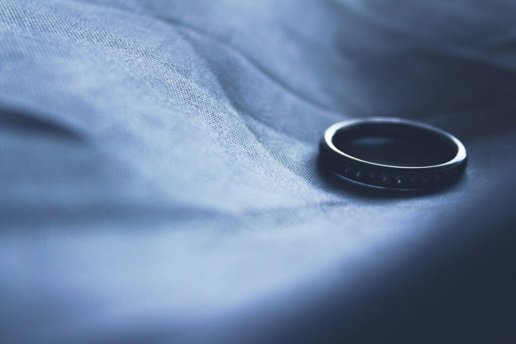 siora-photography-PtMu7D9AhEs-unsplash a ring on top of a cloth