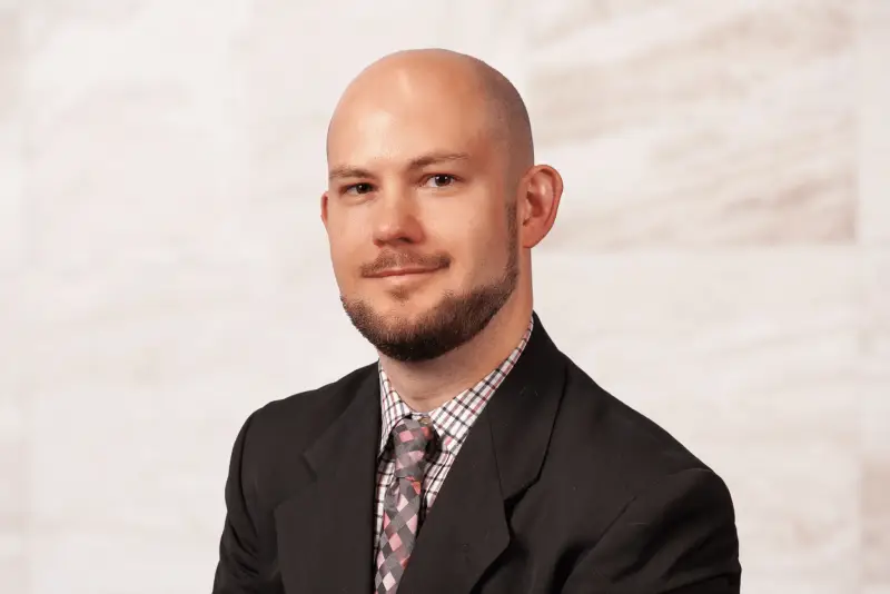 Professional headshot of Houston family law attorney Ricky Whitehead in a suit and tie.