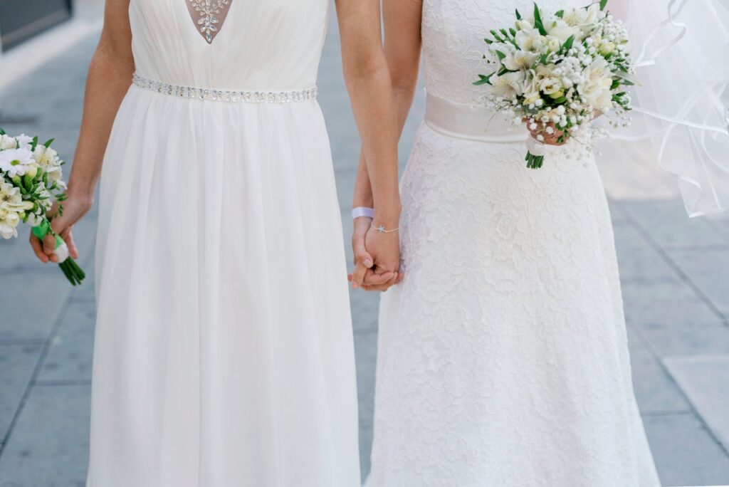 two brides holding a bouquet