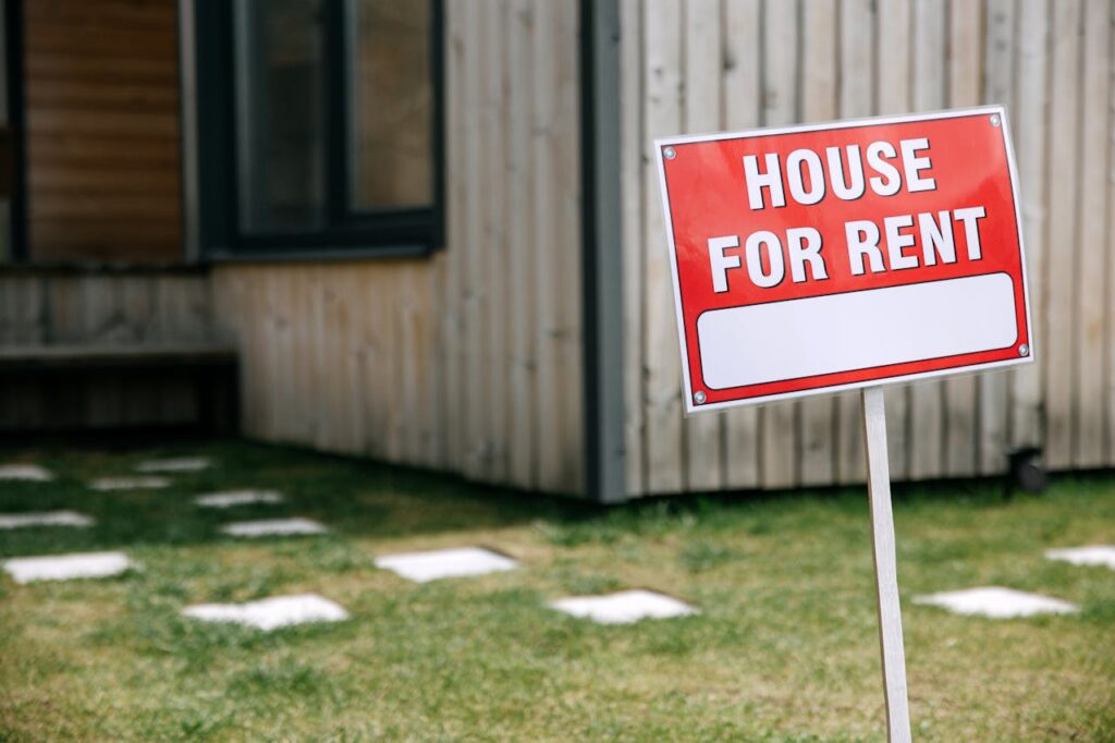 for rent sign in front of a house