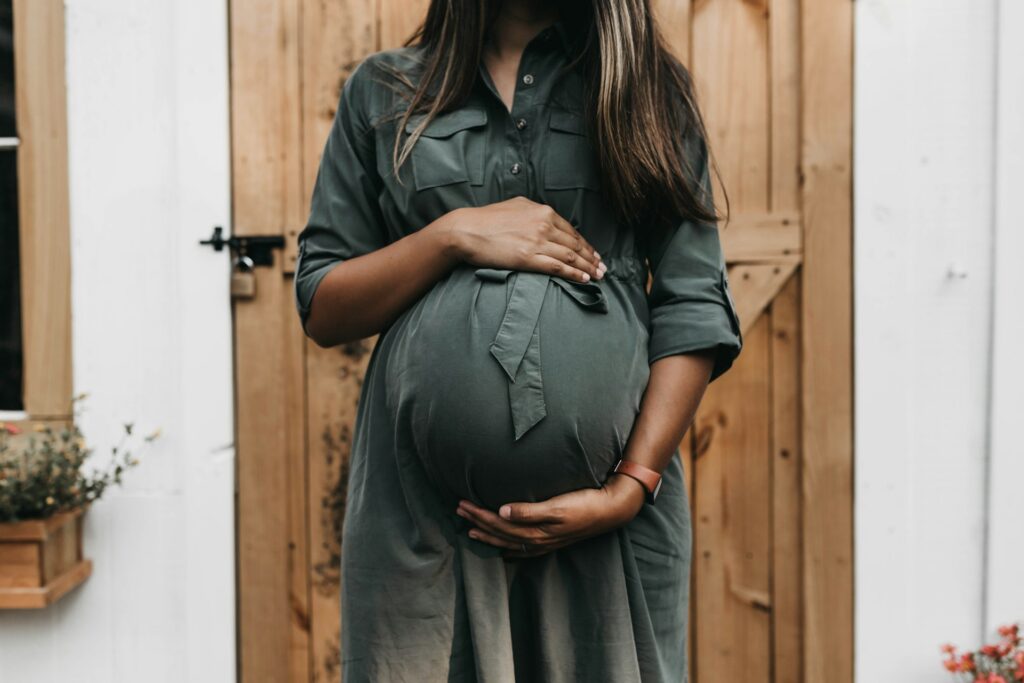 pregnant woman near a door