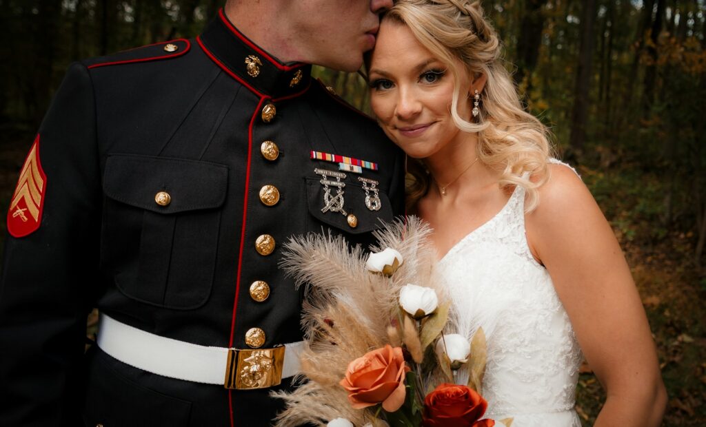 man in military uniform and woman in wedding dress