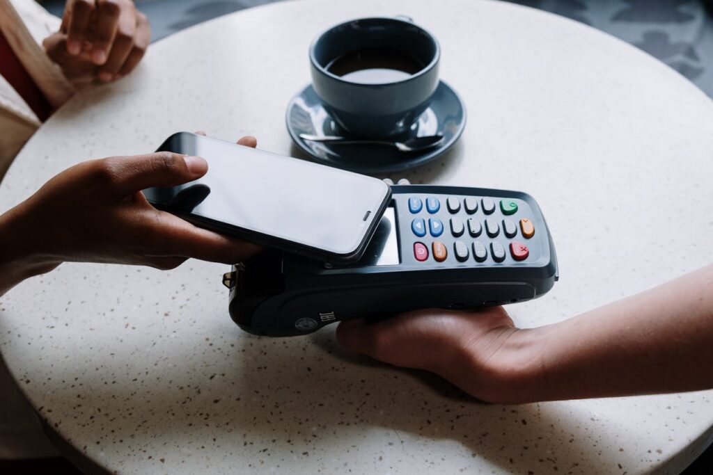 person paying by tapping phone