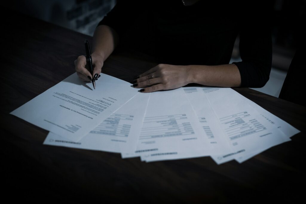 person signing various documents