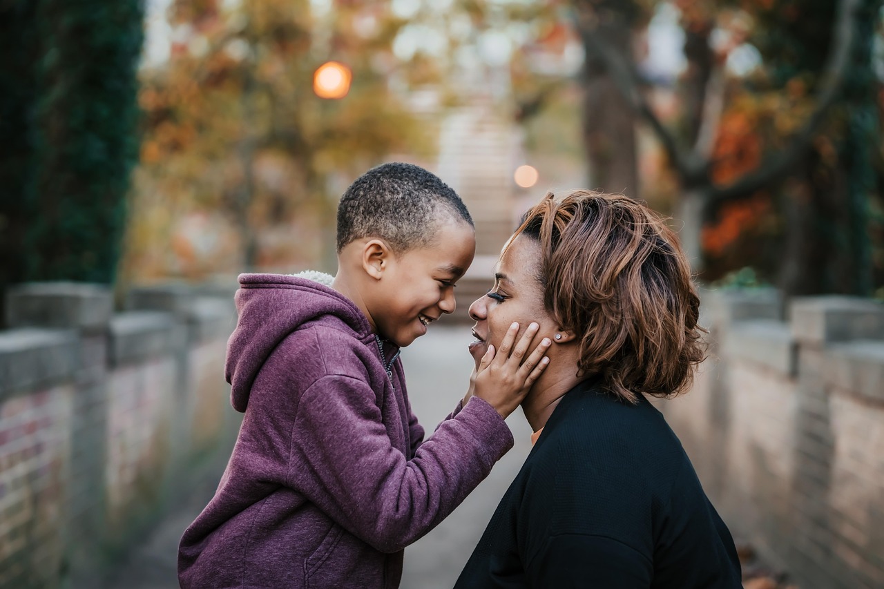 child touching a woman's face