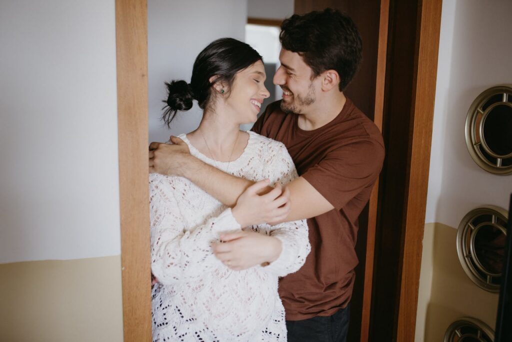 couple hugging at home