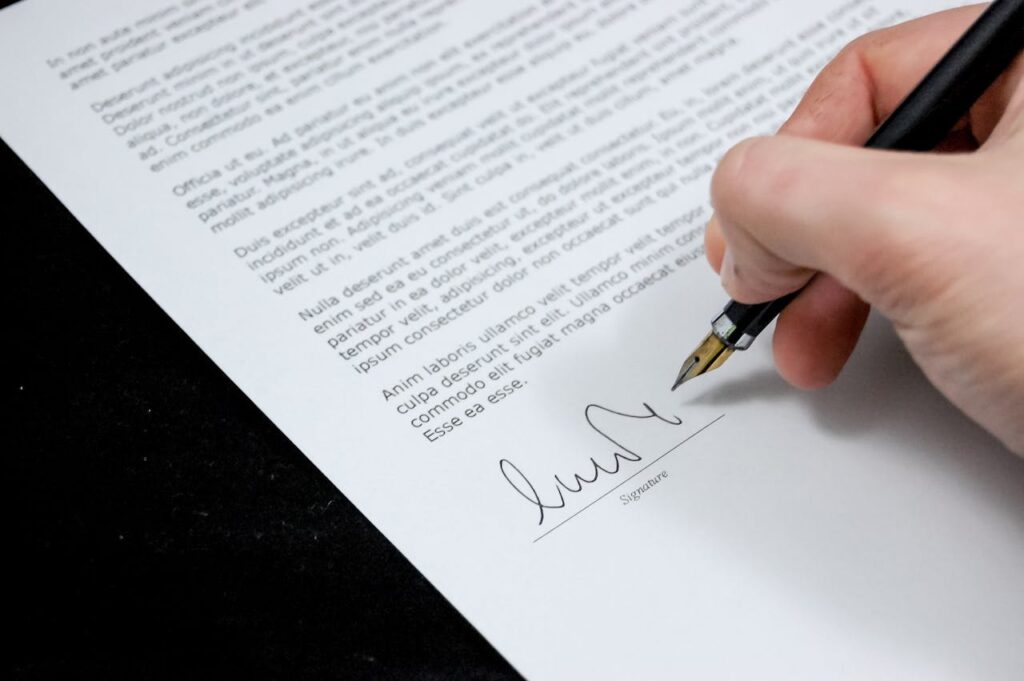 pexels-pixabay-48195 (1) A document being signed