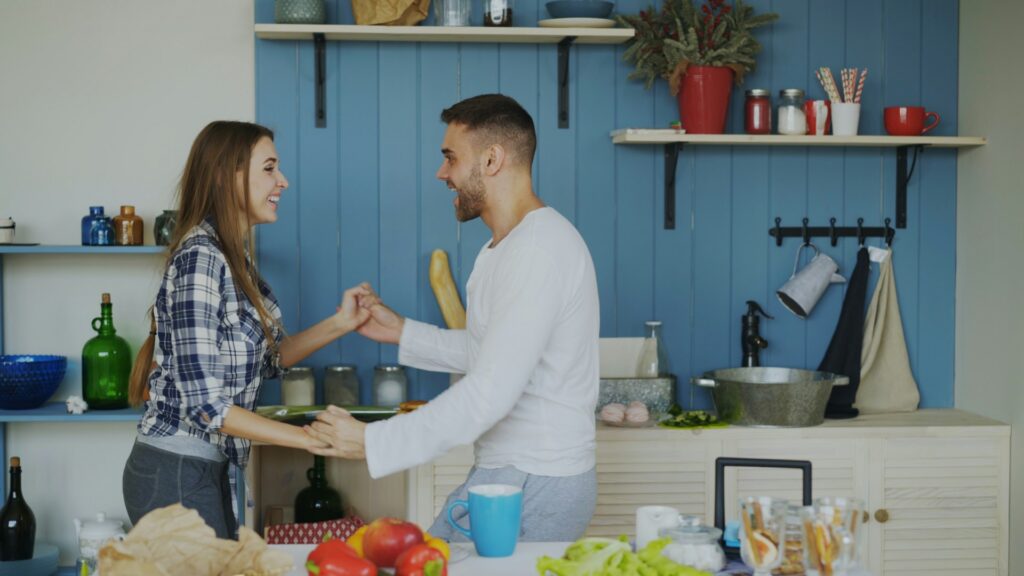 couple dancing in the kitchen
