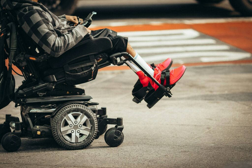 jon-tyson-O7ke8N4kTpQ-unsplash person on a wheelchair