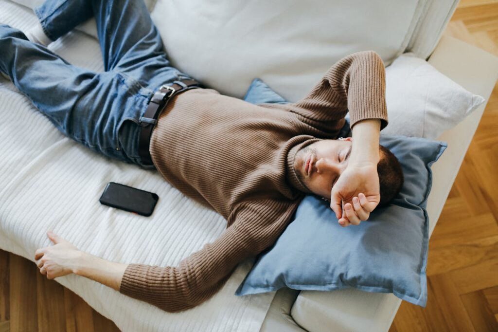 man sleeping on a couch