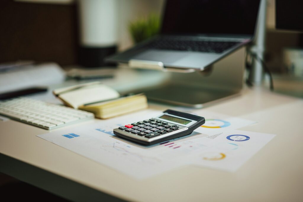 calculator, laptop and notebook