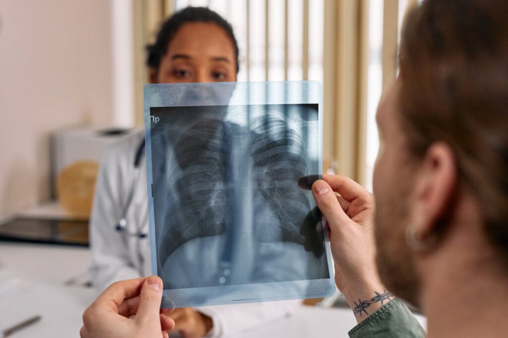 man holding an x-ray result