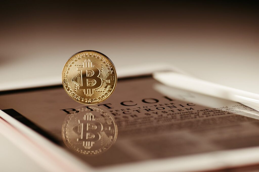 gold bitcoin on glass frame
