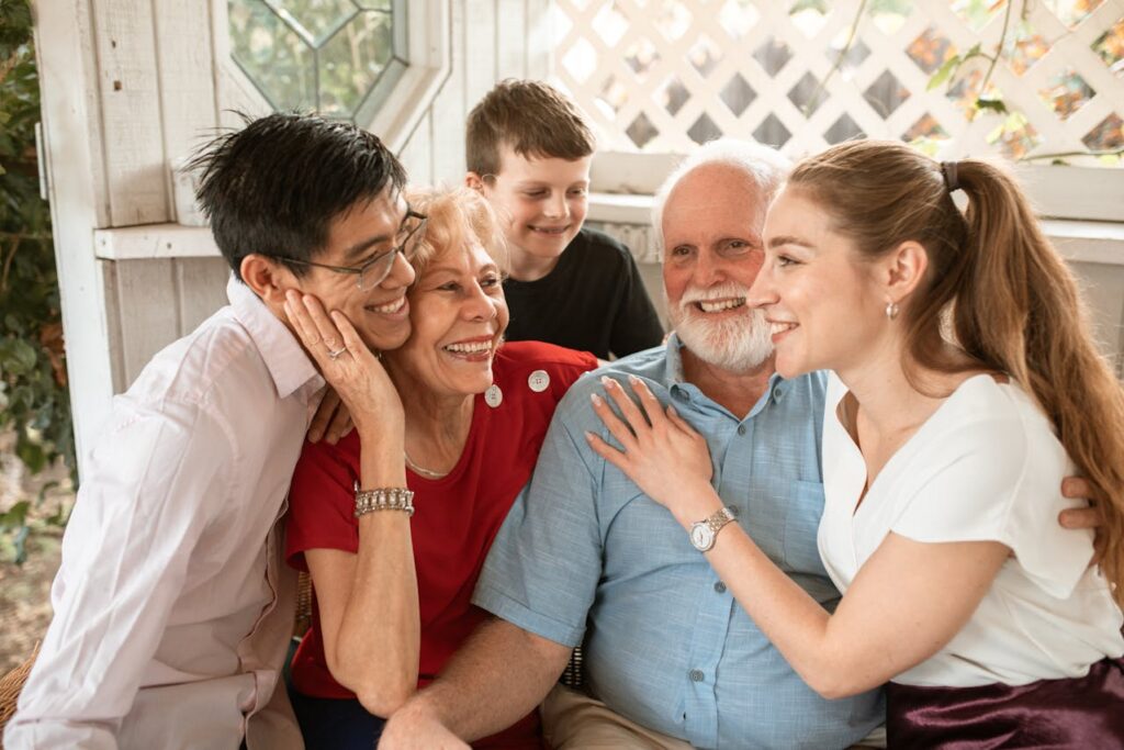elderly couple with family