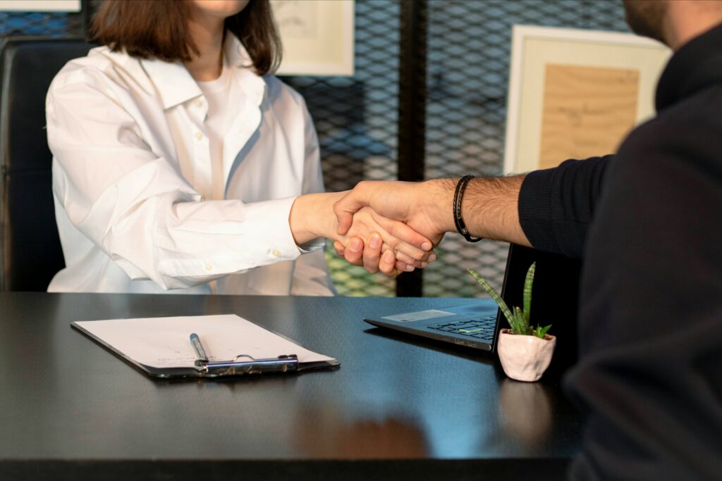 man and woman shaking hands