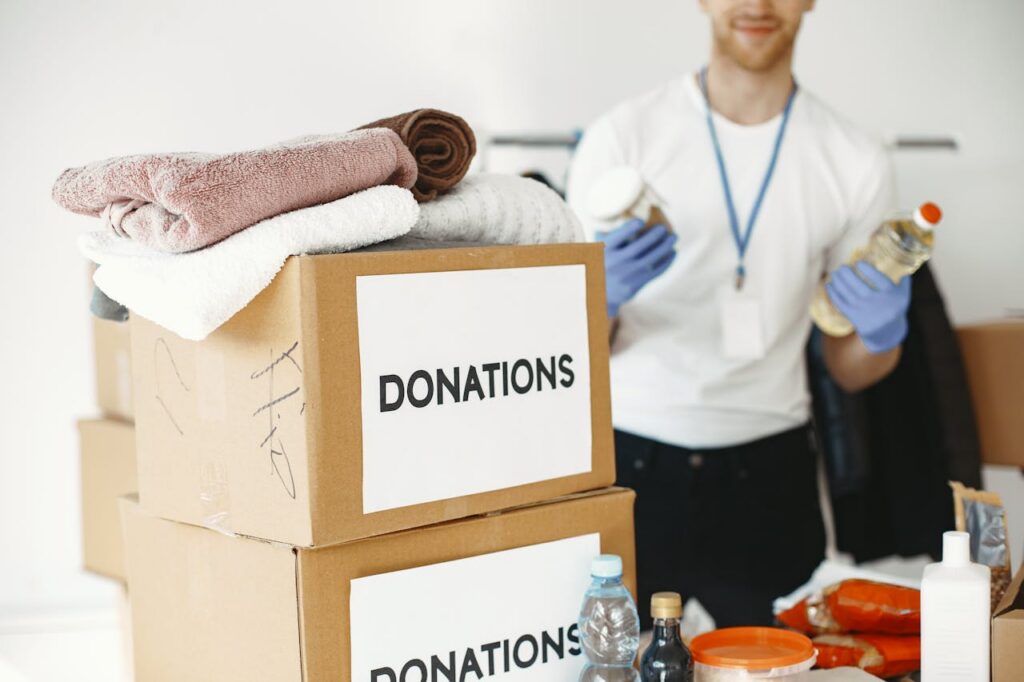 volunteer with donation boxes
