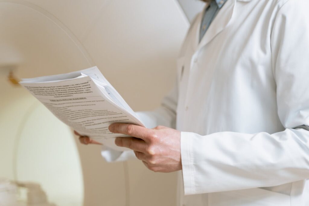 a doctor reviewing a document