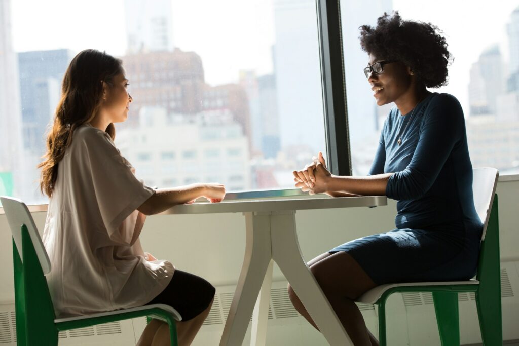 two women talking to each other