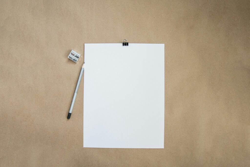 blank paper, pencil and sharpener