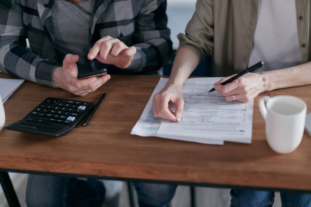 two people computing taxes